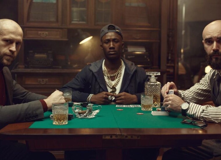 Three professional poker players in a poker table