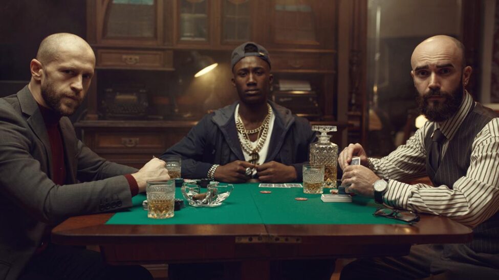 Three professional poker players in a poker table