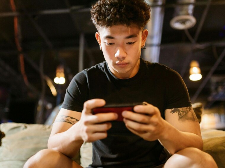 Man Playing Mobile Game
