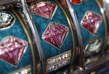 Close-up of a modern slot machine reel showing diamond symbols